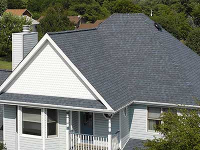 Mid-class home gray CertainTeed shingles on its roof